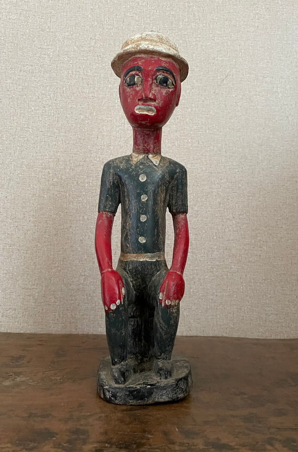 Handcrafted Sculptures - Collection - African Art - Sculptures Statues -  Artwork - Artisan Designed - Handcrafted - Home Decor - Office - Any Room - This vintage African Painted Seated Male Statue is crafted from quality wood, then painted to create a lifelike African sculpture. The perfect addition to your home décor, it measures 15" in height. Add a touch of cultural charm to your interior.