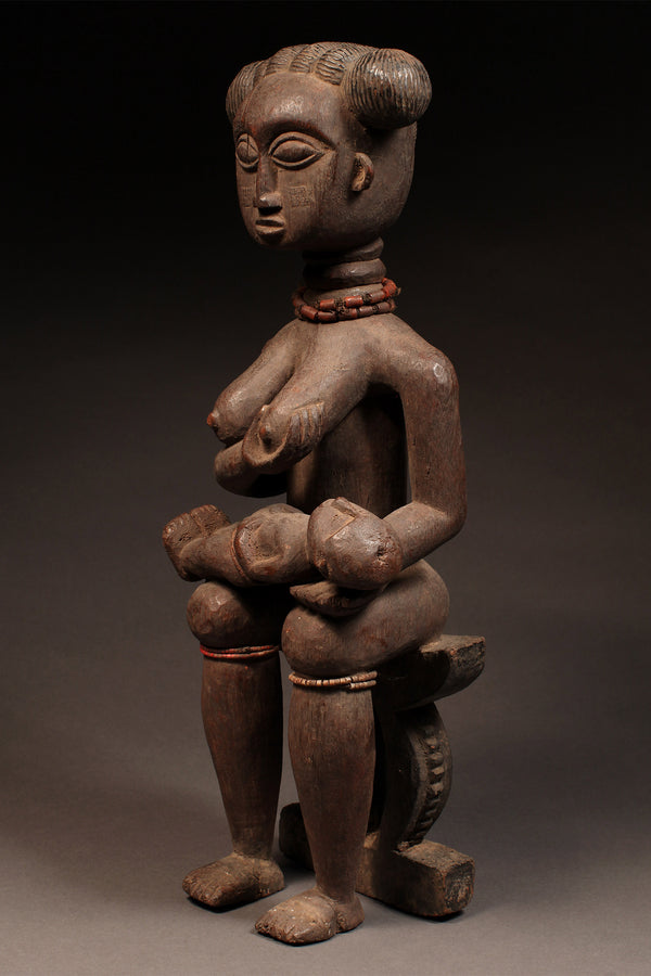 Tribal Sculptures - Home Decor - African Art - Ancestral - Statues Figures - Crafted - Centuries - Old Techniques - Sculptures Cultural - African Heritage - Living Space - This beautiful Ashanti/Asante Maternity Figure is hand-carved from wood in Ghana. Embellished with intricate details, this figure stands 8.7 inches tall and is a stunning representation of African culture. It's the perfect addition to any art collection or home decor.