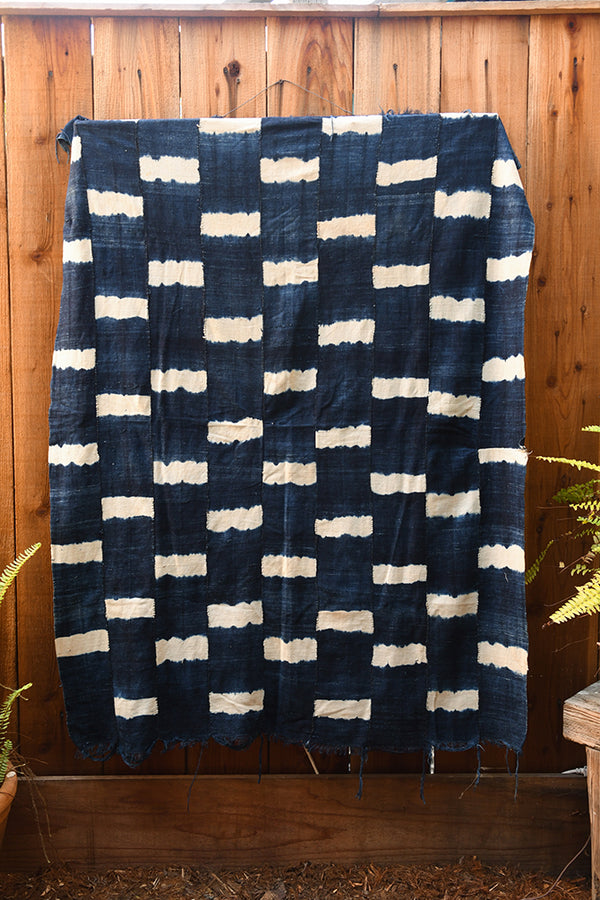 Handcrafted Textiles - Artisan Designed - Handcrafted African Art Textiles - Home Decor - Living Spaces - Mix Colors - Bold Patterns - Traditional Designs - African Culture - This high-quality Indigo Blue fabric is a traditional African textile from the Dogon people of Mali. Authentic and handmade, it features traditional tie-dying in blue and white and is crafted from vintage cotton. Perfect for home decor or any creative project. Length: 58" Width: 43"