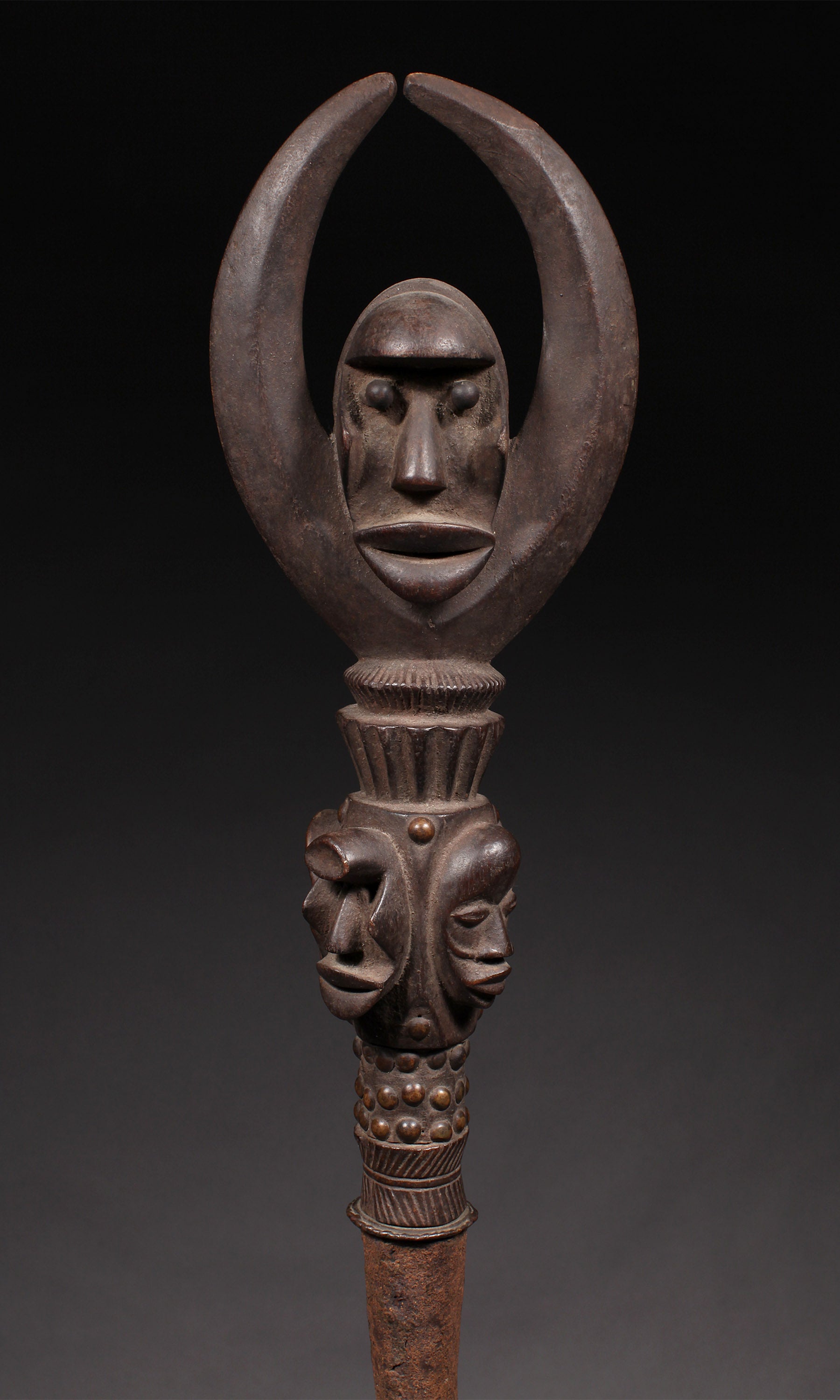 Tribal Objects - African Tribal Art - Ancient Ceremonial Art - Handcrafted Artifacts - Masks - Wood Sculptures - Iron Bronze Objects - Textiles - Art Pieces - African Folk Art - This exquisite Prestige Object from the Dan Tribe of the Ivory Coast is crafted from expertly carved wood and iron. An heirloom-quality artifact, it is a stunning representation of the tribe's art and an elegant addition to any collection of African tribal art. H: 57