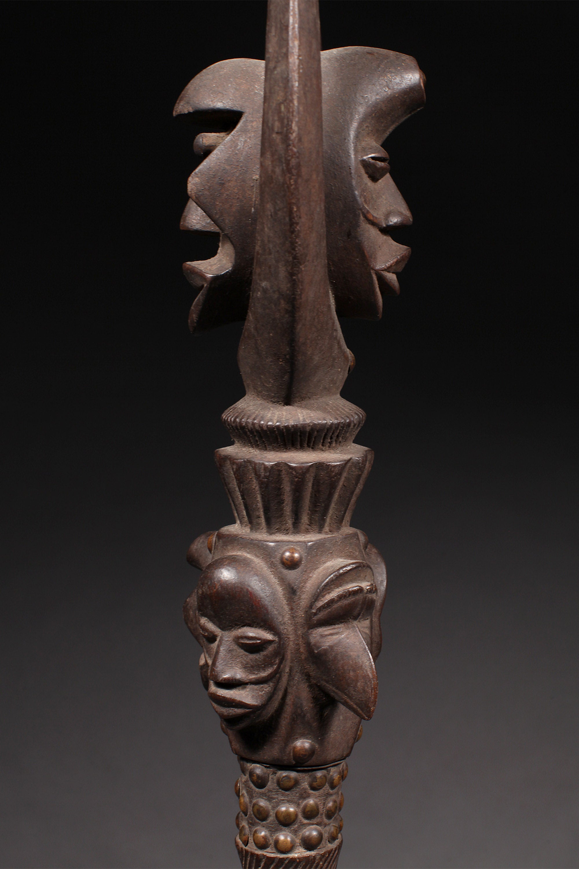 Tribal Objects - African Tribal Art - Ancient Ceremonial Art - Handcrafted Artifacts - Masks - Wood Sculptures - Iron Bronze Objects - Textiles - Art Pieces - African Folk Art - This exquisite Prestige Object from the Dan Tribe of the Ivory Coast is crafted from expertly carved wood and iron. An heirloom-quality artifact, it is a stunning representation of the tribe's art and an elegant addition to any collection of African tribal art. H: 57