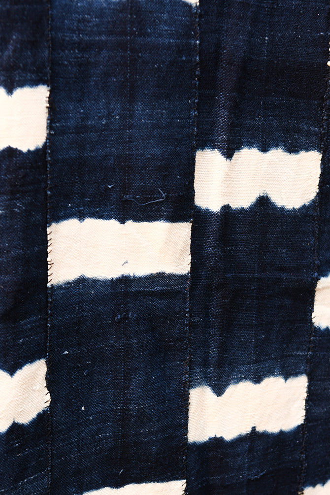 Handcrafted Textiles - Artisan Designed - Handcrafted African Art Textiles - Home Decor - Living Spaces - Mix Colors - Bold Patterns - Traditional Designs - African Culture - This high-quality Indigo Blue fabric is a traditional African textile from the Dogon people of Mali. Authentic and handmade, it features traditional tie-dying in blue and white and is crafted from vintage cotton. Perfect for home decor or any creative project. Length: 58