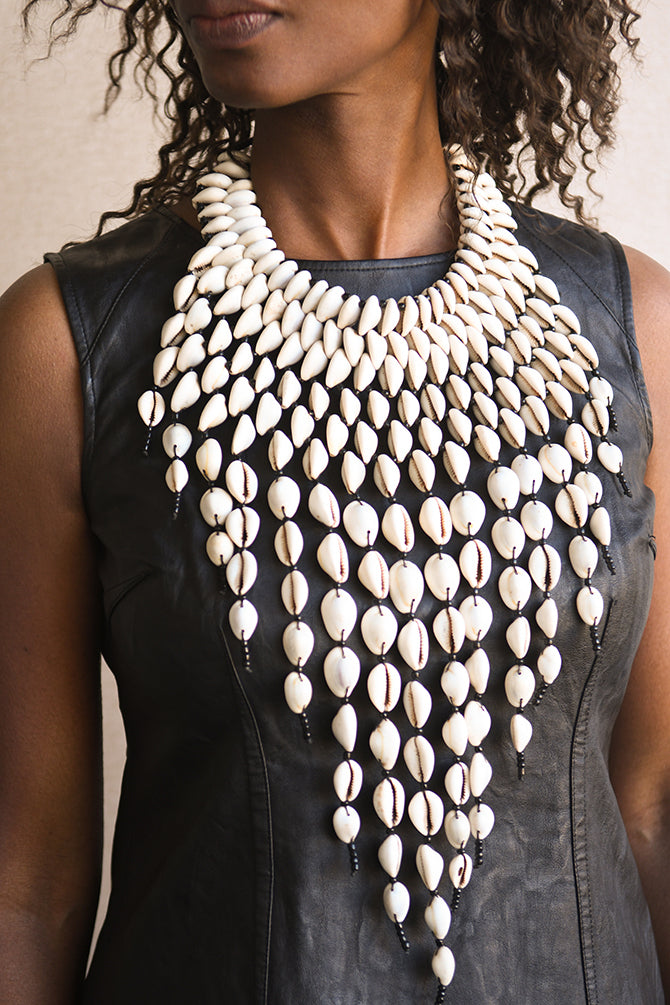 Handcrafted Necklaces - Handmade - African Art - Jewelry - Beaded Necklaces - This Statement Cowrie Shell Necklace is crafted with Authentic Cowrie Shell Beads for a unique and beautiful look.It is a unique piece of African Tribal Jewelry, sure to make a statement. Handmade with love, this is the perfect accessory for any wardrobe. Length: 18