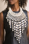 Handcrafted Necklaces - Handmade - African Art - Jewelry - Beaded Necklaces - This Statement Cowrie Shell Necklace is crafted with Authentic Cowrie Shell Beads for a unique and beautiful look.It is a unique piece of African Tribal Jewelry, sure to make a statement. Handmade with love, this is the perfect accessory for any wardrobe. Length: 18" Inventory # 10826