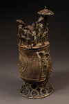 Tribal Objects - African Tribal Art - Ancient Ceremonial Art - Handcrafted Artifacts - Masks - Wood Sculptures - Iron Bronze Objects - Textiles - Art Pieces - African Folk Art - This unique Kuduo Lidded Vessel is an intricately-crafted brass cast from the Asante tribe of Ghana. Intricate designs and symbols, crafted onto the lidded vessel, make it a one-of-a-kind piece of African art. Perfect for the home or office, this Kuduo will be sure to add a touch of elegance and cultural heritage to any space.