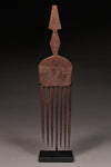 Tribal Objects - African Tribal Art - Ancient Ceremonial Art - Handcrafted Artifacts - Masks - Wood Sculptures - Iron Bronze Objects - Textiles - Art Pieces - African Folk Art - This traditional comb with geometric incisions is hand carved by artisans of the Ashanti Asante Tribe in Ghana. The wood material is sourced locally and its design displays the heritage of African craftsmanship. This piece is a great artifact traditional to any collection of African sculpture.