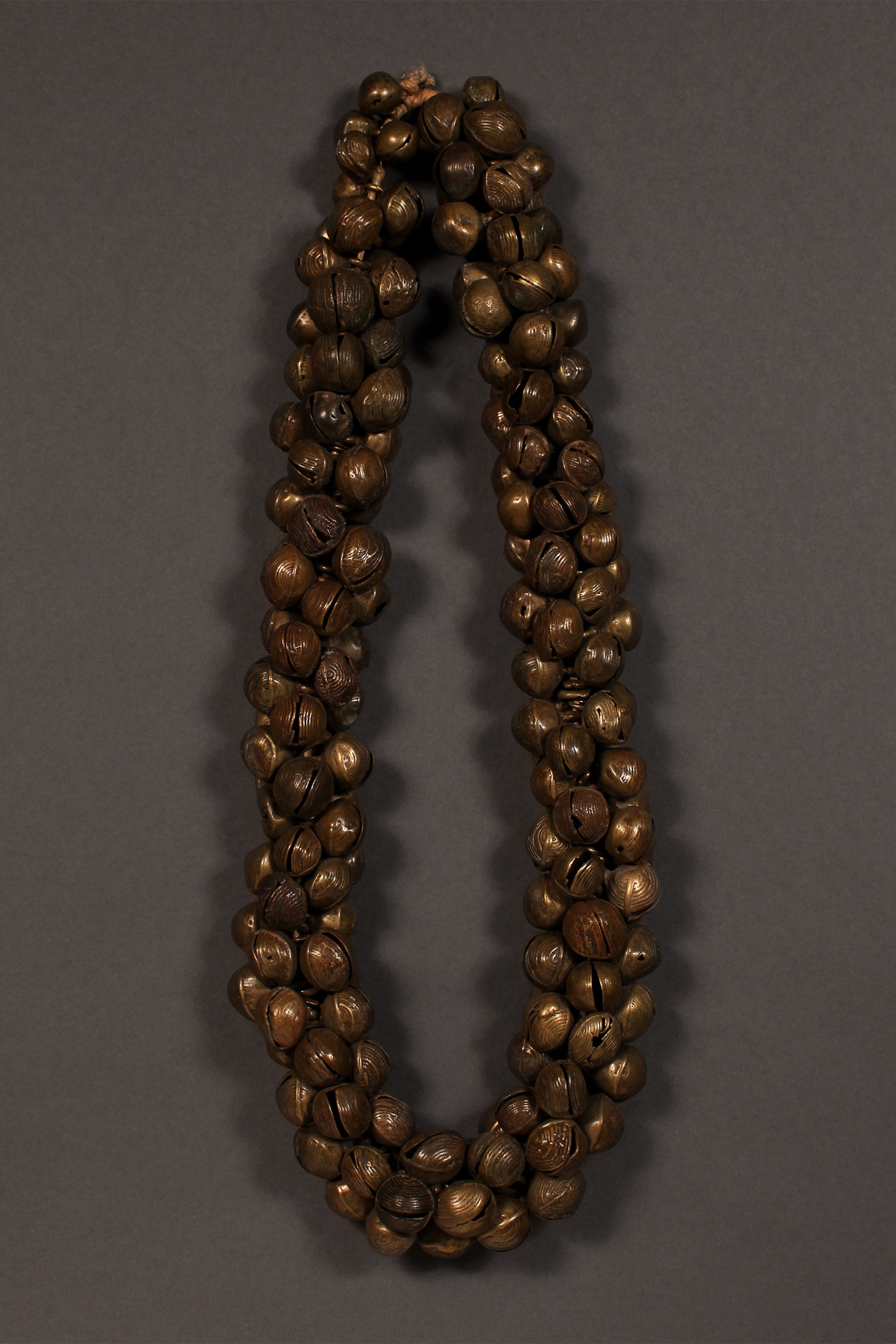 Tribal Trade Beads - African Trade Beads - Tradition - African Decorative Beads - Chevron Millefiori - Krobo - Feather - Melon - King Eye - African Culture - History - Jewelry Making -  This stunning Bronze Necklace is a must-have for collectors. Its full strand of ancient Yoruba Trade Beads gives it an amazing level of detail and a stunning vintage aesthetic. A perfect addition to any jewellery collection, the Bronze Necklace will not disappoint.  Length: 14 inches