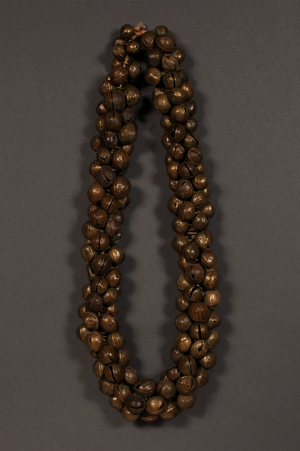 Tribal Trade Beads - African Trade Beads - Tradition - African Decorative Beads - Chevron Millefiori - Krobo - Feather - Melon - King Eye - African Culture - History - Jewelry Making -  This stunning Bronze Necklace is a must-have for collectors. Its full strand of ancient Yoruba Trade Beads gives it an amazing level of detail and a stunning vintage aesthetic. A perfect addition to any jewellery collection, the Bronze Necklace will not disappoint.  Length: 14 inches