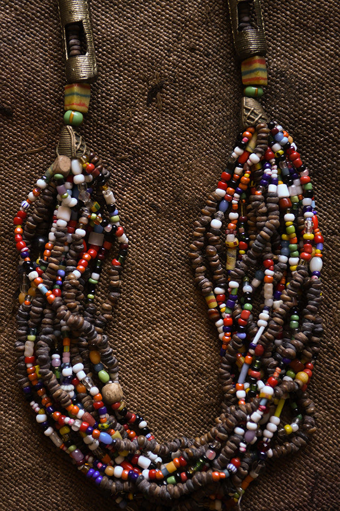 Handcrafted Necklaces - Handmade - African Art - Jewelry - Beaded Necklaces - This unique Beaded Statement Necklace is handmade from African trade beads for a truly one-of-a-kind look. The Tribal African design adds an eye-catching and authentic element to your wardrobe. Perfect for special occasions or everyday wear. Length: 17