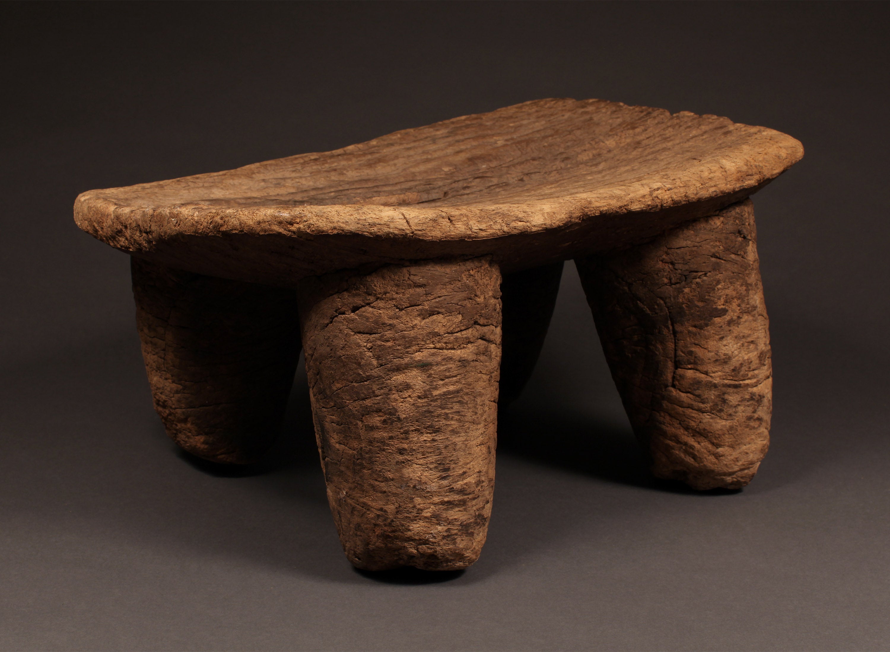 Tribal Furniture - African Art - Home Decor - African Stools - Chairs - Traditional Furniture - Collectible Art - This stunning antique stool is handcrafted from wood by the Senufo Tribe. Its rich, warm tones perfectly complement any home décor and its refined details make it a unique piece of art. Be sure to add this beautiful and functional piece to your collection.
