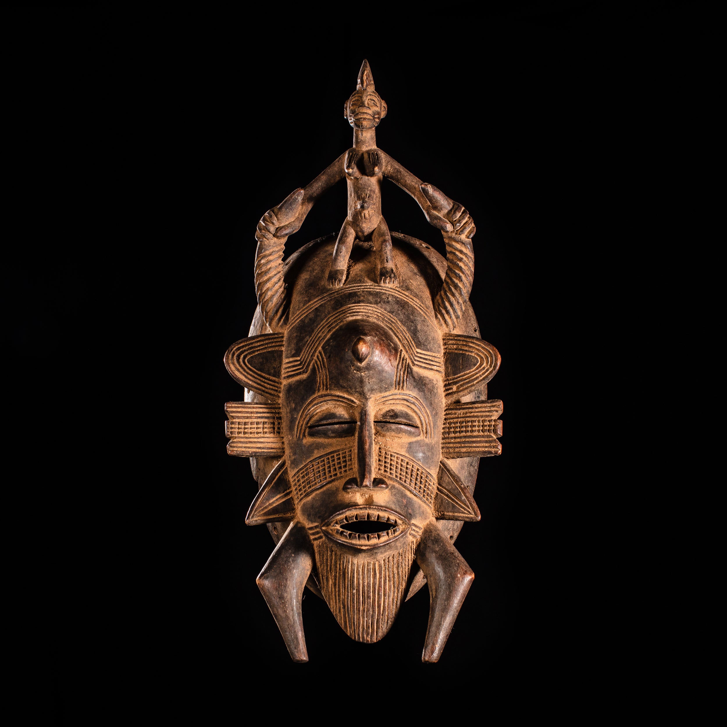 Tribal Masks - Handcrafted - Senufo Masks - Traditional Folk Art - African Artifacts Sculptures - African Art Collector - This Senufo tribal face mask from Kpelie is crafted from wood, with finely painted detail and raised accents. It makes an excellent addition to any home or art collection, offering a unique visual aesthetic and cultural representation. Heigh 14