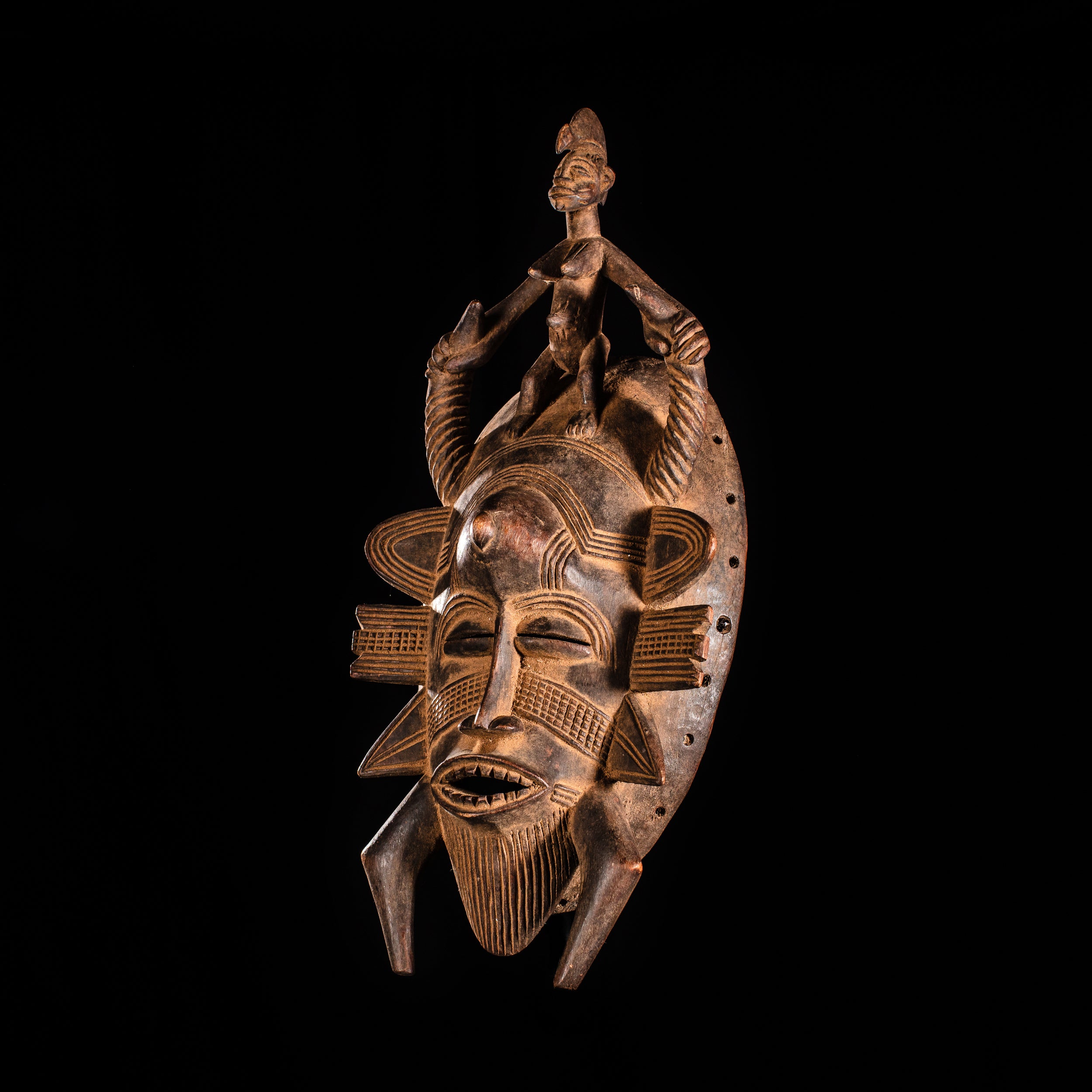 Tribal Masks - Handcrafted - Senufo Masks - Traditional Folk Art - African Artifacts Sculptures - African Art Collector - This Senufo tribal face mask from Kpelie is crafted from wood, with finely painted detail and raised accents. It makes an excellent addition to any home or art collection, offering a unique visual aesthetic and cultural representation. Heigh 14