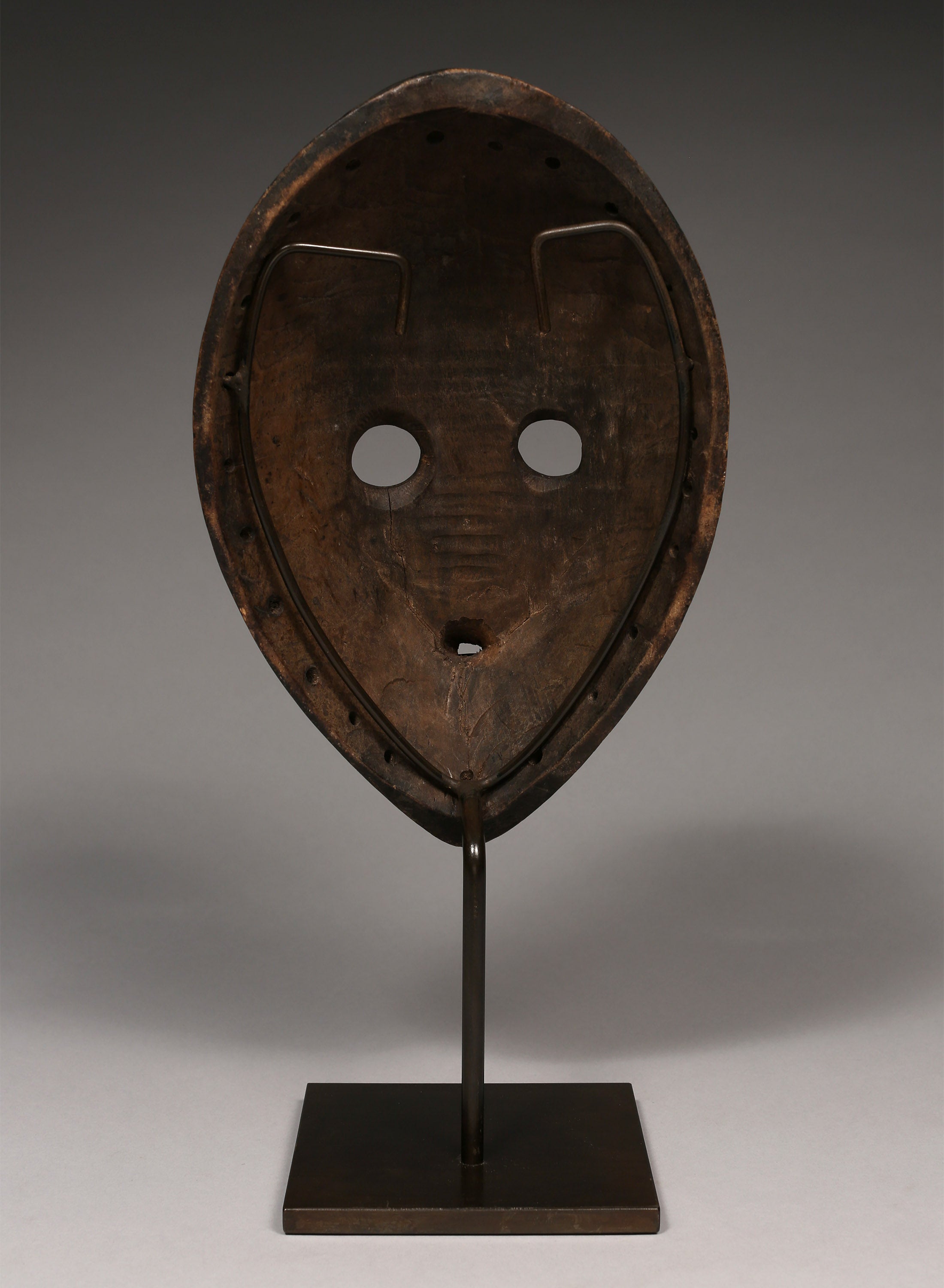Tribal Masks - Handcrafted - Dan Masks - Traditional Folk Art - African Artifacts Sculptures - African Art Collector - This Gunye Ge mask from the Dan Tribe features exquisite wooden carving, capturing the distinctive artistry and cultural heritage of Africa. An impressive piece featuring intricate detail, it is sure to be a stunning addition to any art collection. H: 10.5