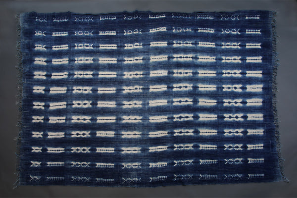 Handcrafted Textiles - Artisan Designed - Handcrafted African Art Textiles - Home Decor - Living Spaces - Mix Colors - Bold Patterns - Traditional Designs - African Culture - This Dyed Indigo Blue White Vintage Cloth is perfect for home decor projects. It's made from a high-quality African Mossi cotton fabric tie-dyed with a Shibori Indigo dye. The blue and white pattern creates a stunning effect that will elevate any space. 74 " X 50" Inventory # 10819