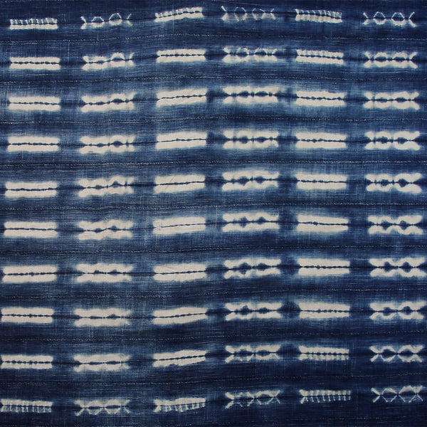 Handcrafted Textiles - Artisan Designed - Handcrafted African Art Textiles - Home Decor - Living Spaces - Mix Colors - Bold Patterns - Traditional Designs - African Culture - This Dyed Indigo Blue White Vintage Cloth is perfect for home decor projects. It's made from a high-quality African Mossi cotton fabric tie-dyed with a Shibori Indigo dye. The blue and white pattern creates a stunning effect that will elevate any space. 74 " X 50" Inventory # 10819