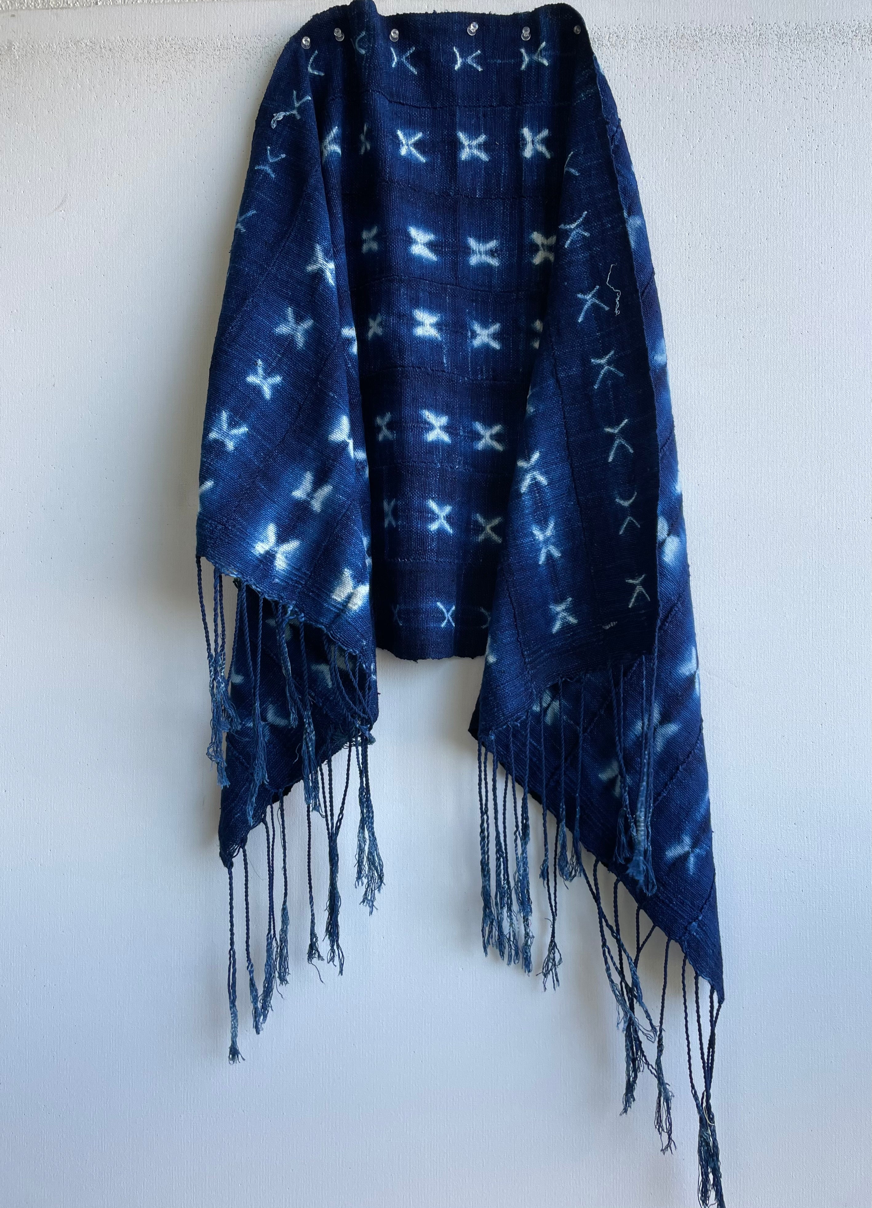 Handcrafted Textiles - Artisan Designed - Handcrafted African Art Textiles - Home Decor - Living Spaces - Mix Colors - Bold Patterns - Traditional Designs - African Culture - Craft a bohemian-inspired look with this vintage African indigo Tie Dyed Blue Cotton Textile Scarf. Made with lightweight cotton fabric, this scarf is stylish and timeless, featuring classic fringed edges for a touch of elegance. Whether layered or worn alone, this unique scarf is a perfect addition to any wardrobe