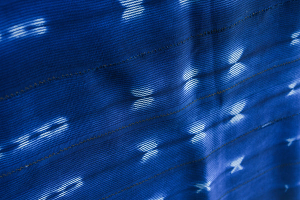 Handcrafted Textiles - Artisan Designed - Handcrafted African Art Textiles - Home Decor - Living Spaces - Mix Colors - Bold Patterns - Traditional Designs - African Culture - This Dyed Baule Ikat Indigo Cotton Cloth is perfect for home décor, bringing African culture to your living room. Hand-crafted with a unique Ikat pattern, this cloth offers beauty and durability, making for a stunning and long-lasting piece of decor. Length: 56 inches Width: 40 Inches