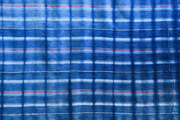 Handcrafted Textiles - Artisan Designed - Handcrafted African Art Textiles - Home Decor - Living Spaces - Mix Colors - Bold Patterns - Traditional Designs - African Culture - This African Indigo Cotton Fabric is a unique Tie Dyed Vintage Baule Textile. Carefully crafted with skill and precision, this eye-catching fabric is perfect for adding an exotic flair to home decor. Length: 60 inches Width : 39 inches