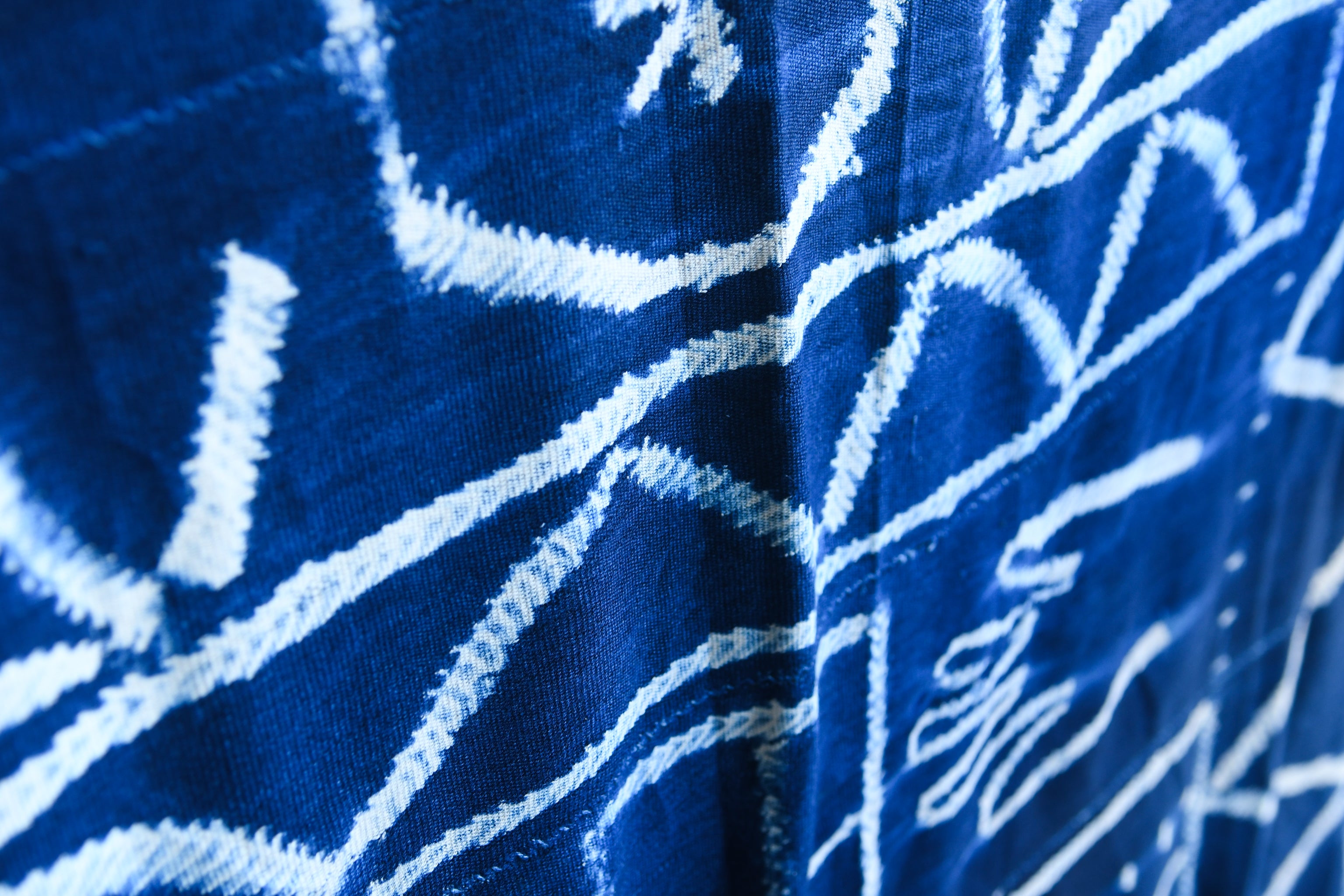 Handcrafted Textiles - Artisan Designed - Handcrafted African Art Textiles - Home Decor - Living Spaces - Mix Colors - Bold Patterns - Traditional Designs - African Culture - Indigo Tie Dyed Textile, featuring a Vintage African Fabric design, is a one-of-a-kind product. It is hand crafted using traditional methods of tie dyeing, resulting in a unique and timeless article of clothing.  Length: 61  Width: 42