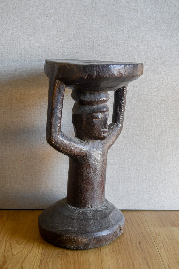 Tribal Furniture - African Art - Home Decor - African Stools - Chairs - Traditional Furniture - Collectible Art - This traditional African Yoruba Caryatid Stool is a stunning piece of furniture art. Hand-crafted from premium wood, it is strong and durable. Its unique design features a caryatid figure which provides a unique focal point for any room. A perfect addition to any home, this Yoruba Caryatid Stool is sure to add a touch of tradition and culture. Height : 18 inches Width: 10.5 inches
