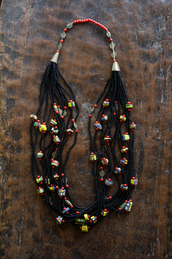 Tribal Necklaces - Handmade - African Art - Jewelry - Traditional - African Necklaces - Beaded - Collectible Necklaces - This Tribal Beaded, African Necklace is a stylish and unique way to express yourself. Crafted with mixed Venetian Millefiori Glass Trade Beads, this Tribal Necklace is sure to turn heads. Enhance any wardrobe with the eye-catching design of this piece. Length: 16 inches