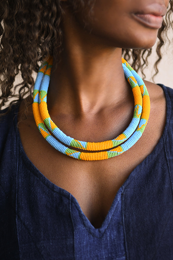 Handcrafted Necklaces - Handmade - African Art - Jewelry - Beaded Necklaces - This African Tribal Necklace is a timeless piece of jewelry crafted with quality. Featuring a beaded collar design, it is sure to make a statement. The intricate craftsmanship and vibrant colors make it the perfect addition to any wardrobe. Inventory # 10886 Length: 10 inches