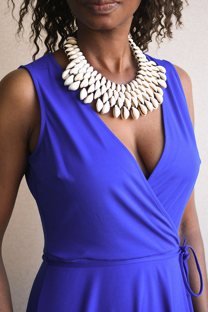 Handcrafted Necklaces - Handmade - African Art - Jewelry - Beaded Necklaces - This Statement Beaded Collar Necklace is an authentic piece of African jewelry, featuring Cowrie Shell beads for a unique and stylish look. Ideal for adding a touch of culture and vibrancy to any ensemble, this necklace is a must-have for your jewelry collection. Length: 9