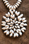 Handcrafted Necklaces - Handmade - African Art - Jewelry - Beaded Necklaces - This Statement African Jewelry Necklace is handmade and features an authentic Cowrie Shell Beads Pendant. Its intricate design adds to any look, making it a classic and chic closet staple. Length: 14 inches Inventory # 10831