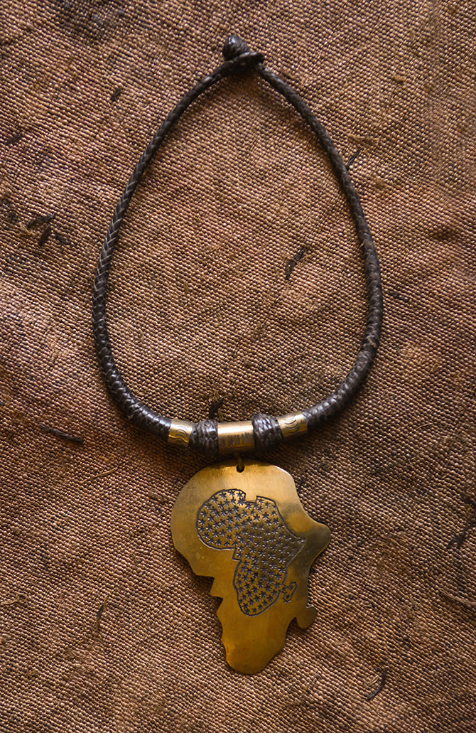 Handcrafted Necklaces - Handmade - African Art - Jewelry - Beaded Necklaces - This beautiful Africa Map pendant necklace is finely crafted from premium leather and bronze. It's perfect for any occasion and adds a unique tribal touch to your wardrobe. The intricate detailing and timeless design will last for years to come! Length: 12