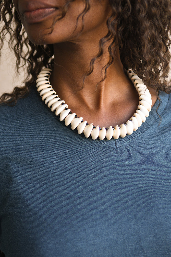 Handcrafted Necklaces - Handmade - African Art - Jewelry - Beaded Necklaces - This African Choker Jewelry is the perfect accessory for the modern woman. Handmade with authentic Cowrie shells, it is sure to add a unique and exotic beauty to your style. Its bold and eye-catching design makes it a timeless piece that can be passed down for generations. Length: 9