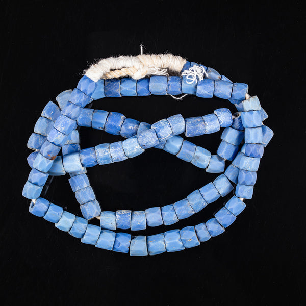 Tribal Trade Beads - African Trade Beads - Tradition - African Decorative Beads - Chevron Millefiori - Krobo - Feather - Melon - King Eye - African Culture - History - Jewelry Making - Add unique flair to your handmade jewelry with these Russian Blue Faceted Trade Beads. These African glass trade beads are truly collectible, featuring a distinctive deep blue color and beautiful facets that create a bewitching sparkle. Perfect for adding an eye-catching touch to any look. Inventory #10651
