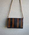 Handcrafted Bags - Artisans Designer - Handbags - Bags - Handcrafted Art Bags - Accessories - One - of - a - kind - Product - Quality Materials - Stylish Products - Durable - This Shoulder Leather Clutch Bag is the perfect addition to any wardrobe, crafted for durability and with an eye-catching Tribal African pattern. Featuring genuine leather and an adjustable strap, you can enjoy both comfort and security in this stylish handbag.